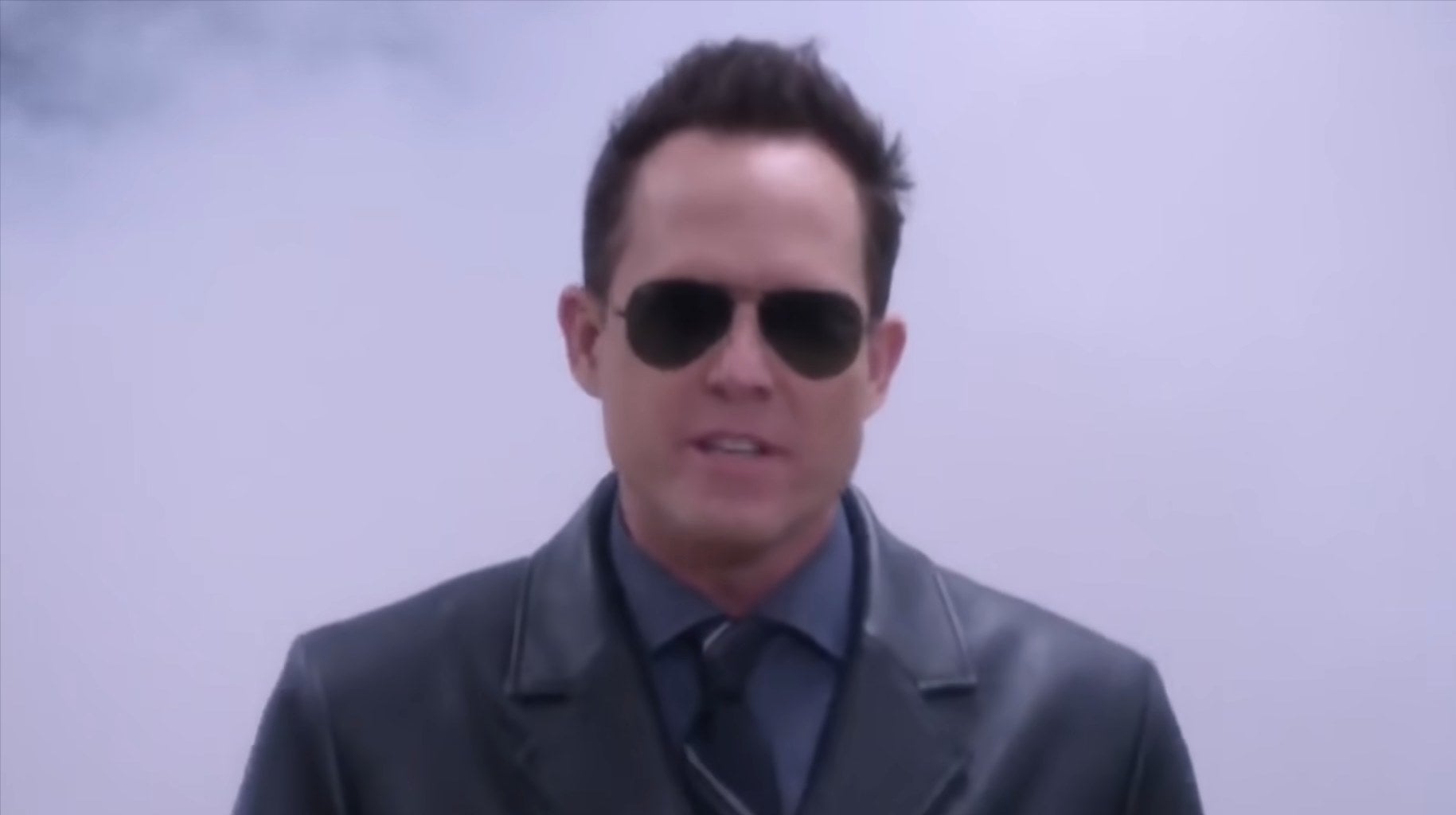 The Vulture wearing sunglasses in a cloud of tear gas in "Brooklyn Nine-Nine"