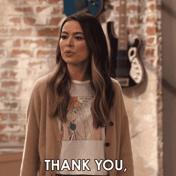 GIF woman saying thank you for the compliment