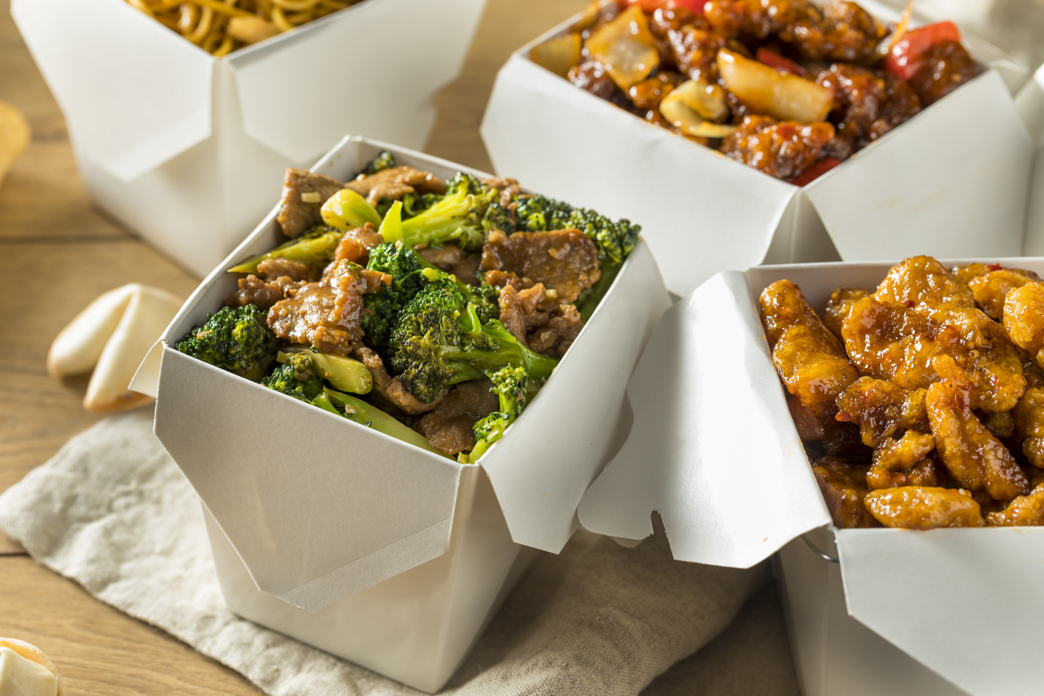 Take-out boxes of Chinese food.