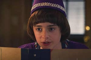 will from stranger things wears a small hat and has a relaxed fact