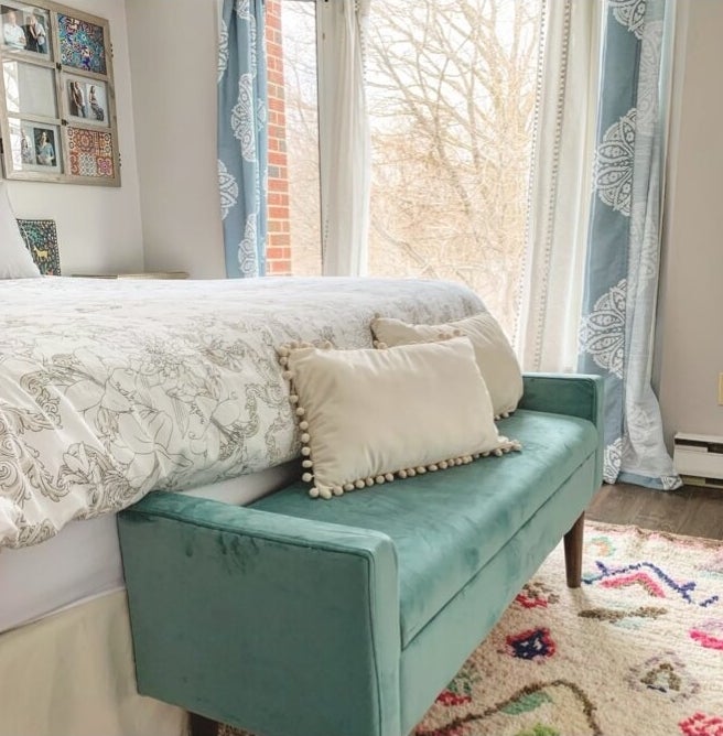 The storage bench at the end of the bed