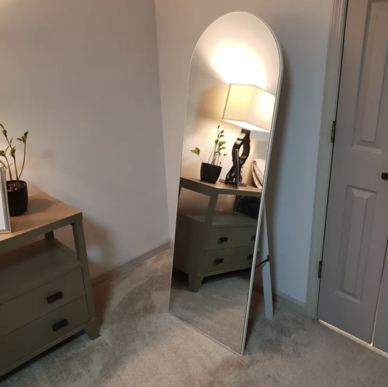 The mirror leaning in a bedroom