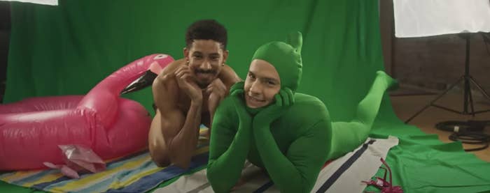 Keiynan Lonsdale and Dylan Sprouse pose in front of a green screen.