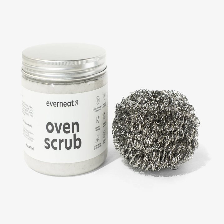 the oven scrub in a plastic container and a steel scrubber