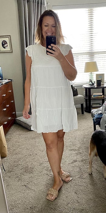 reviewer wearing the dress in white