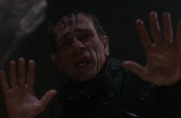 Tommy Lee Jones as Samuel Gerard puts his hands up when he encounters Richard Kimble in a tunnel