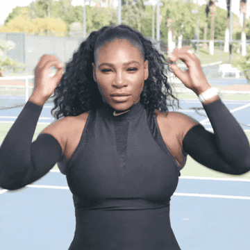 Tennis great Serena Williams makes a hand gesture to show her mind being blown