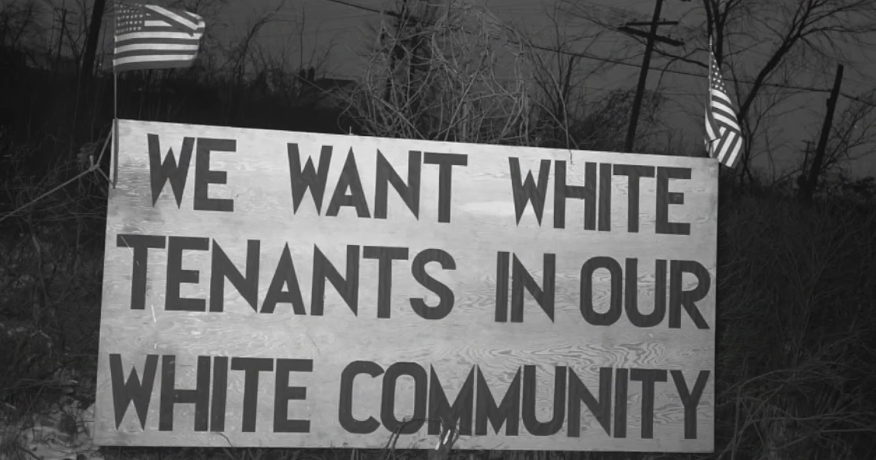 A sign that says, &quot;We want white tenants in our white community&quot;