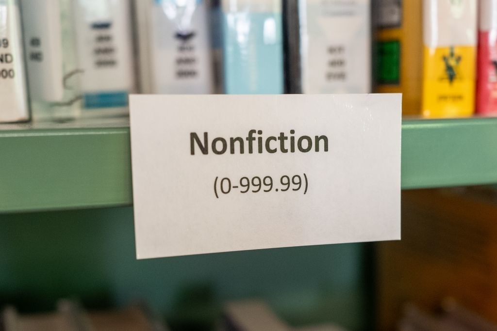 a nonfiction shelf in a library