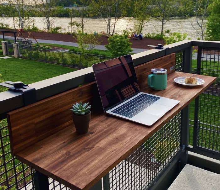 The bar on a balcony with a laptop on it