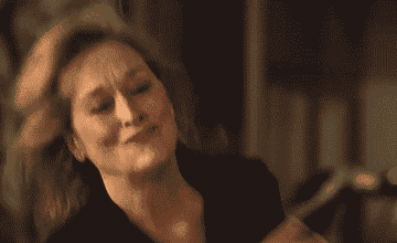 Gif of Meryl Streep dancing happily in the music video for Paul McCartney&#x27;s song &quot;Queenie Eye&quot;