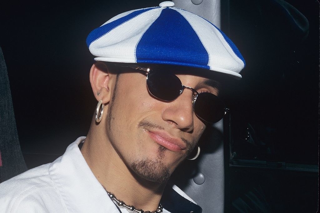 AJ McLean from the Backstreet Boys in a two-toned cap and sunglasses