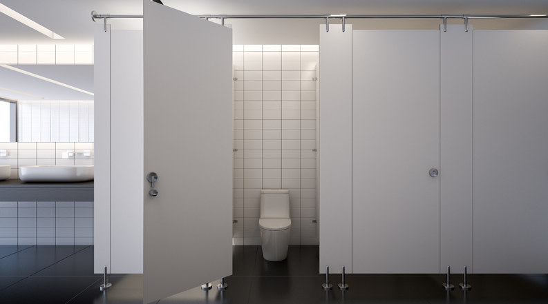 A toilet in a public bathroom