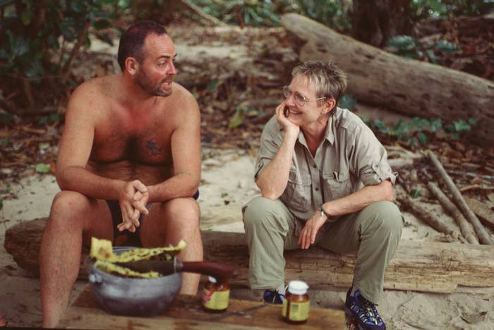 Richard Hatch and Sonja Christopher sit on a bench together