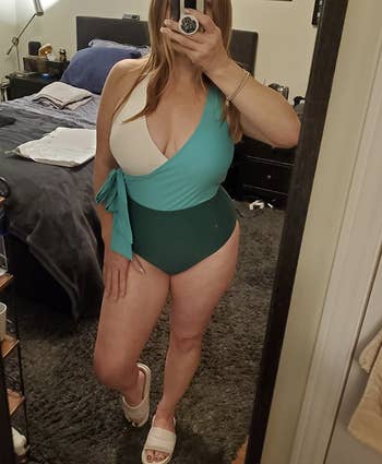 reviewer wearing blue bathing suit in mirror selfie