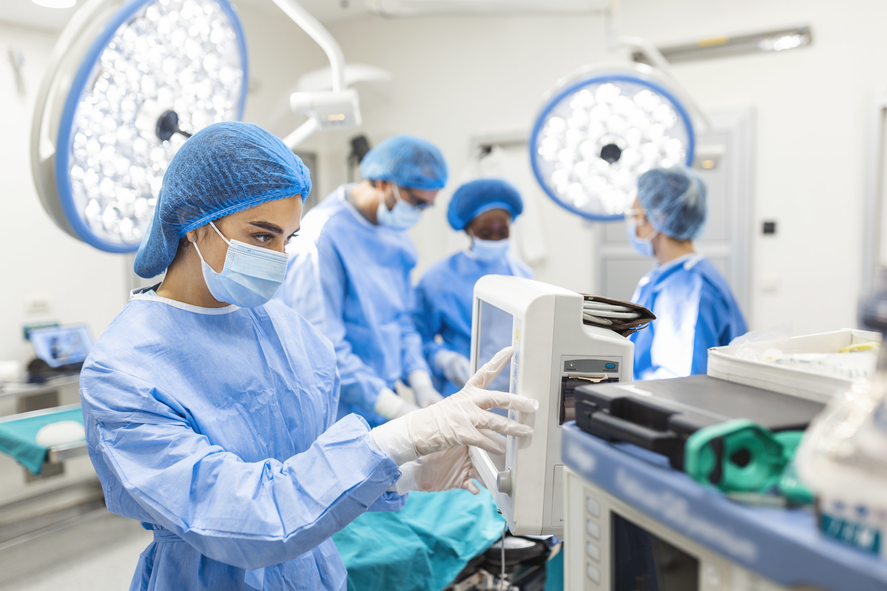 Anesthesiologist keeping track of vital functions of the body during cardiac surgery