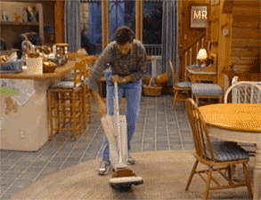 Gif of Bob Saget as Danny Tanner cleaning vacuum in &quot;Full House&quot;