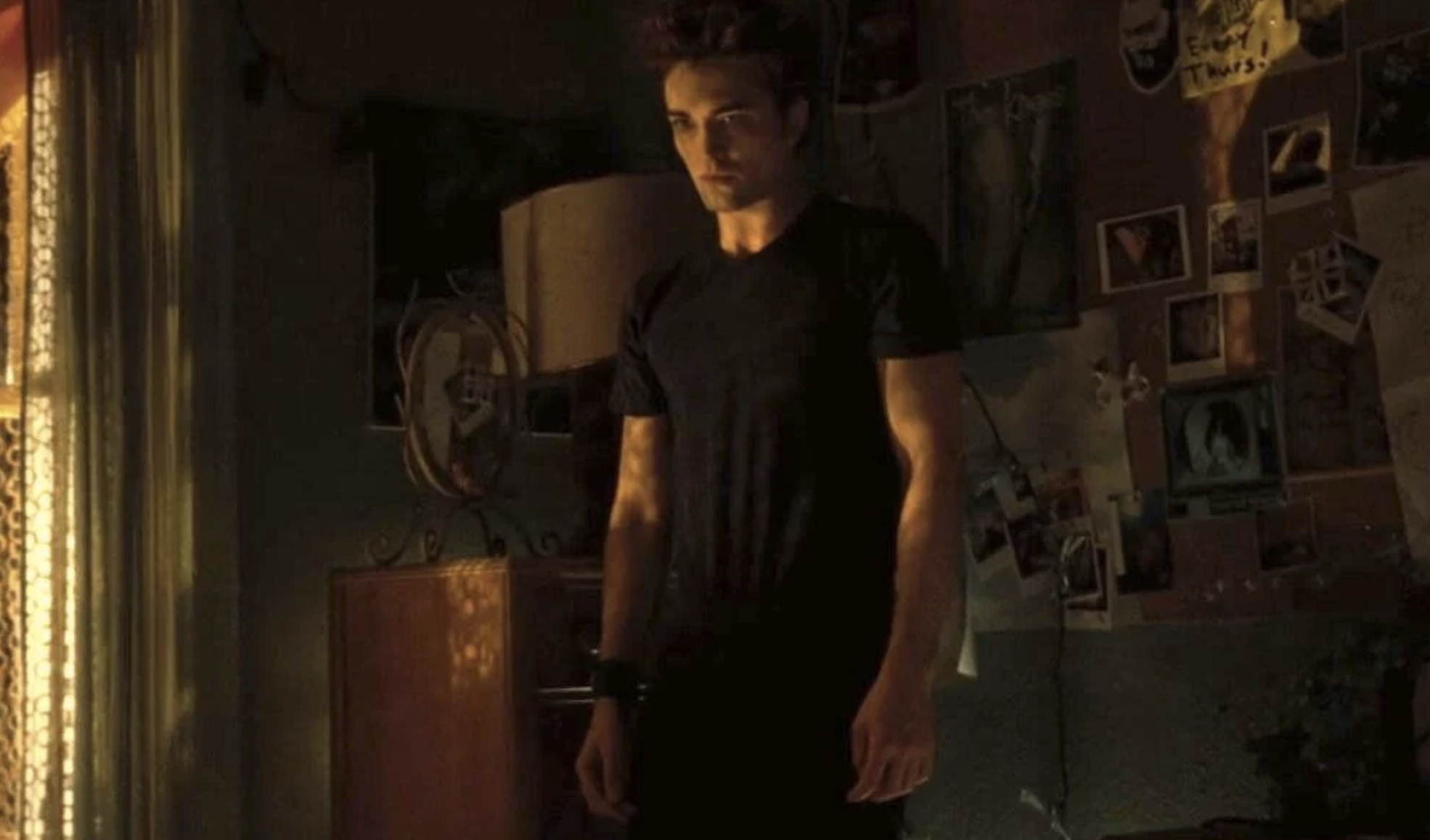 Edward Cullen standing in the corner of Bella&#x27;s room in a scene from twilight