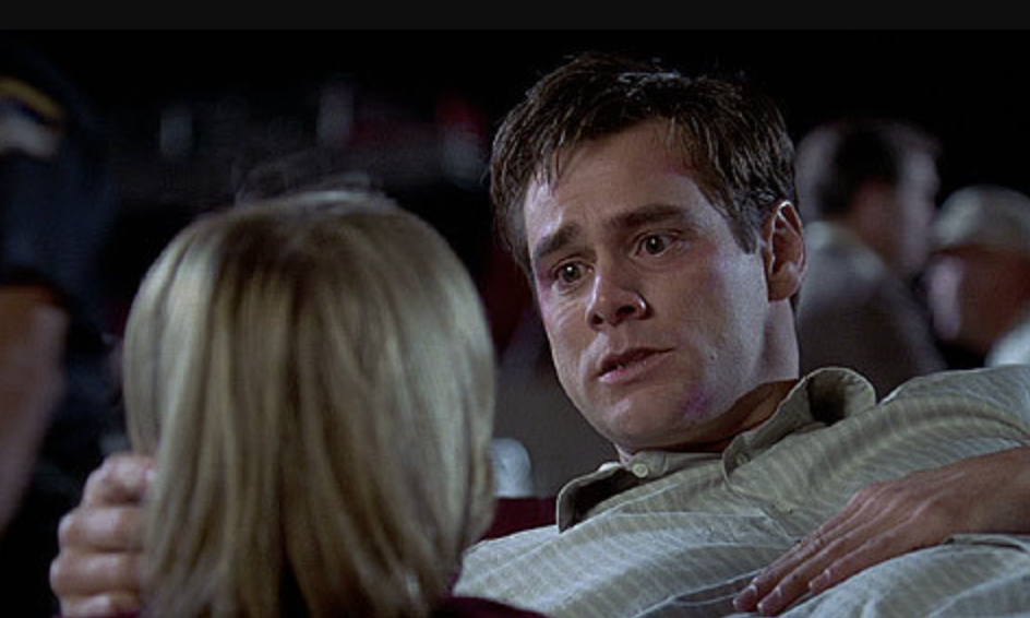 an injured Jim Carrey looking at his ex wife in scene from liar liar