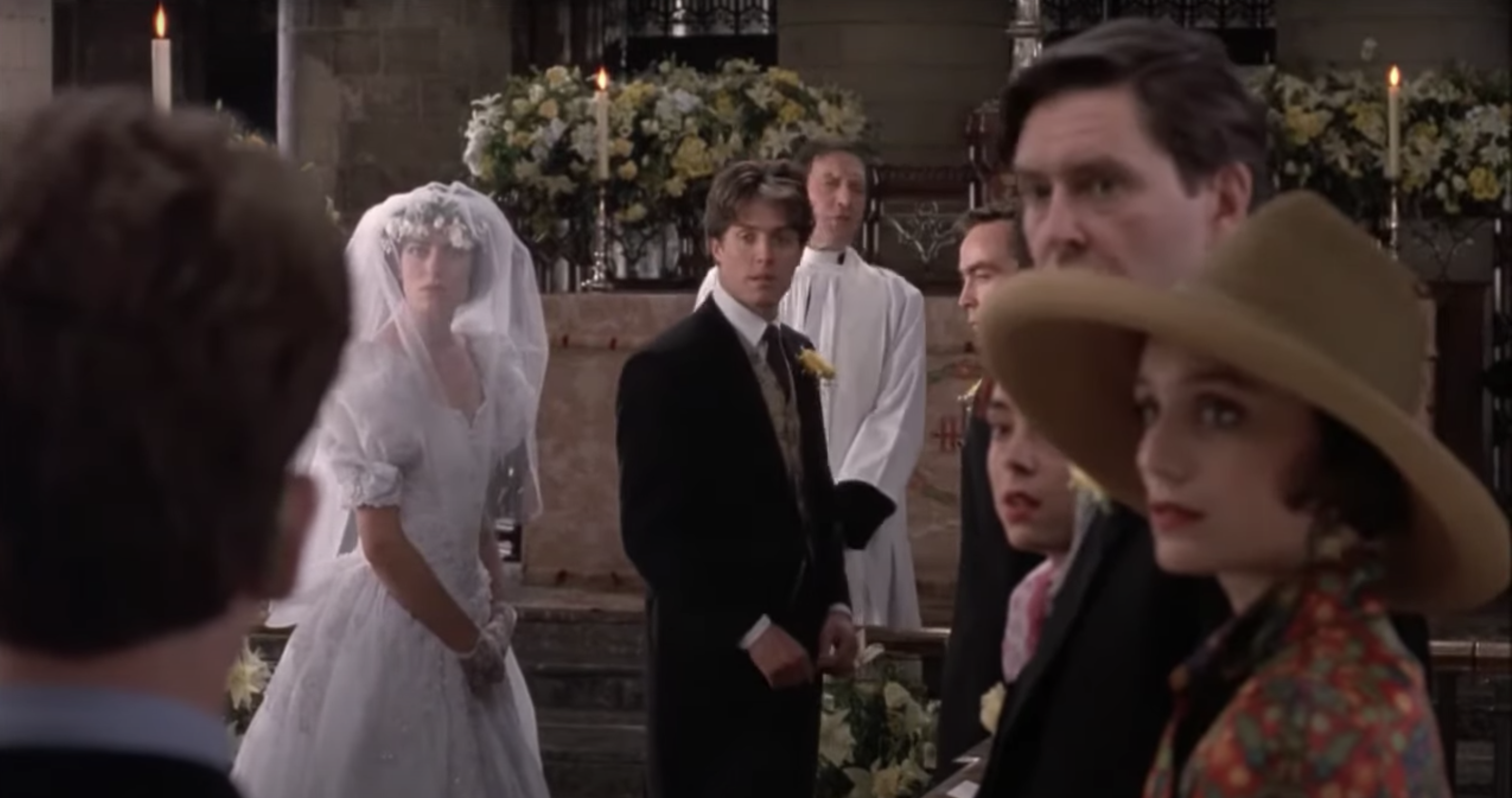bride and groom looking back at the wedding guests in Four Weddings and a Funeral