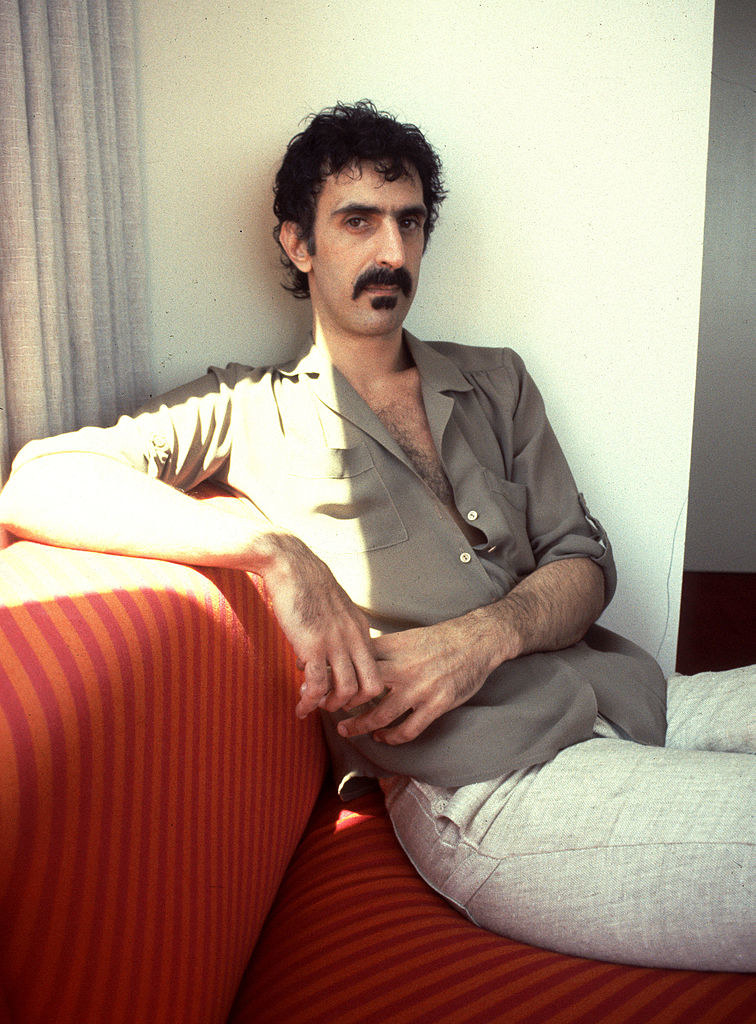 Zappa posing on a sofa for a picture in 1982