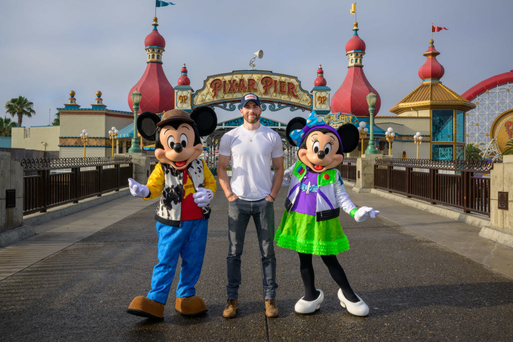 Chris posing with Mickey and Minnie Mouse