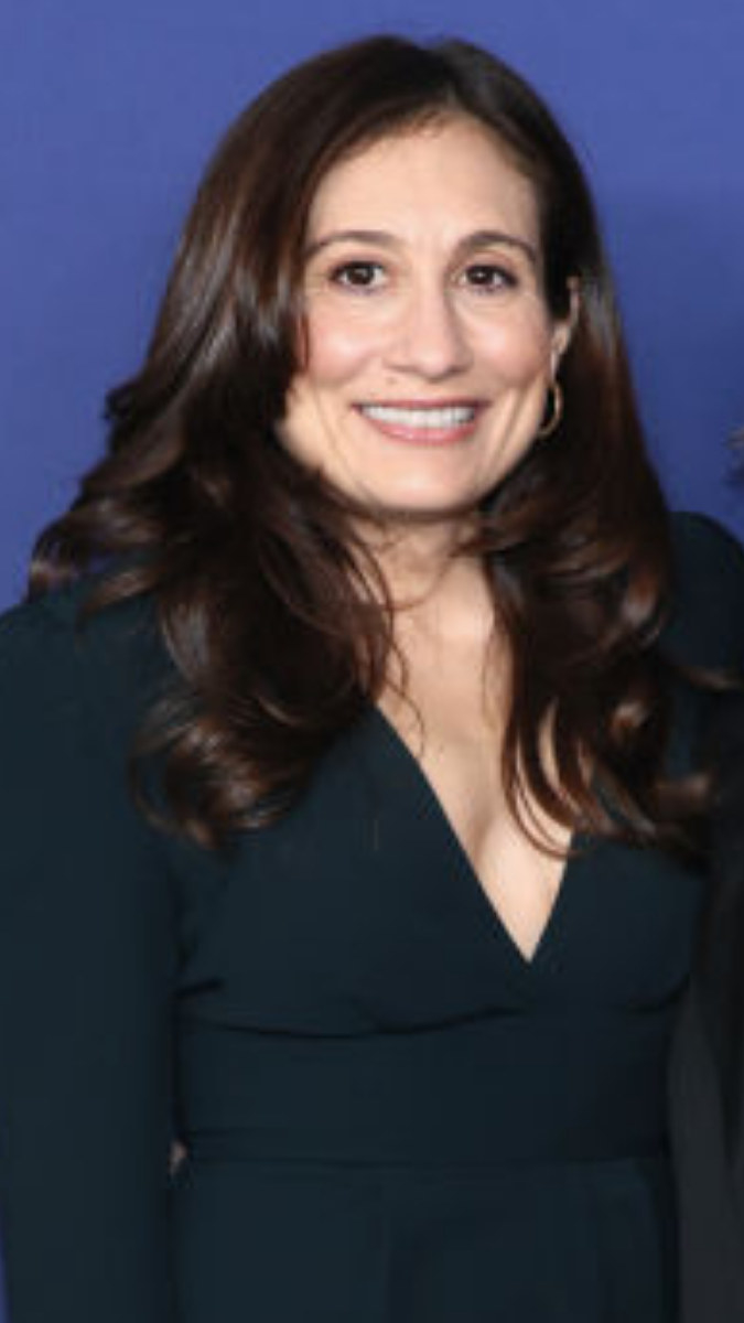 Lucy DeVito smiling at Disney Upfront in 2022