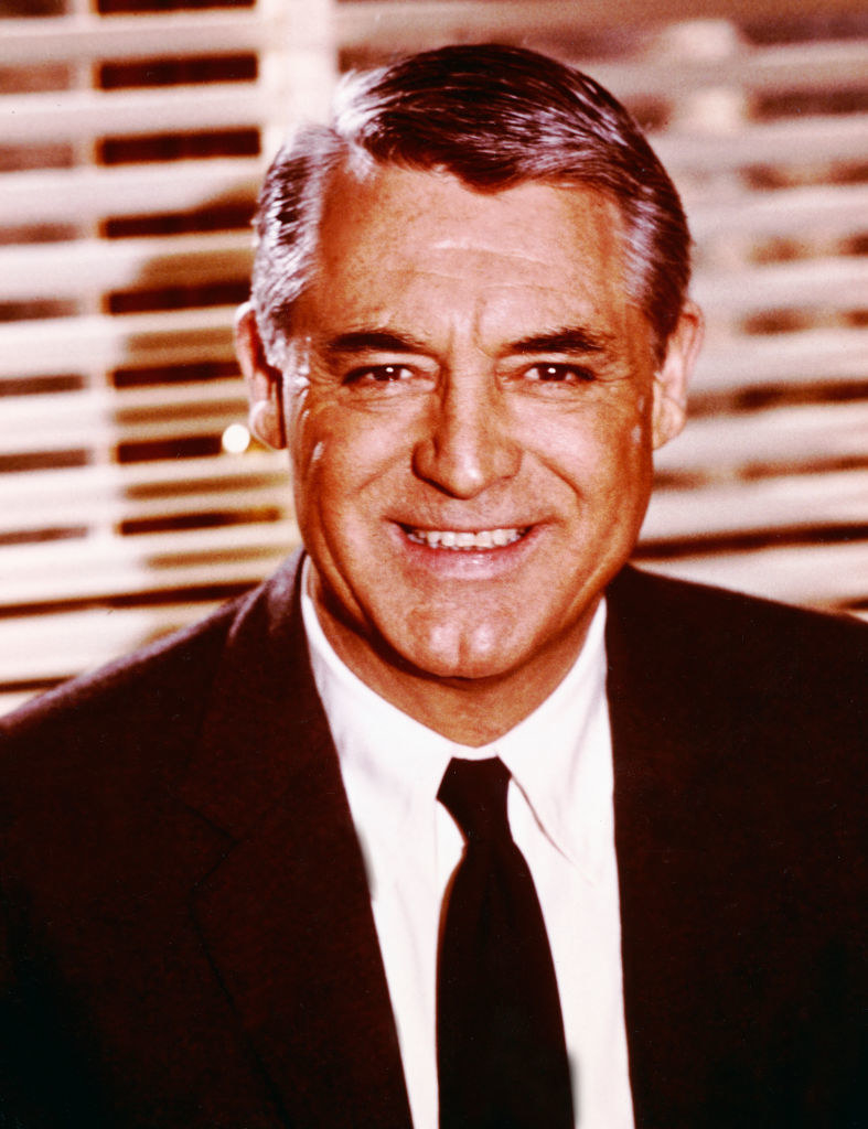 Grant in a suit and tie posing for a portrait in 1960