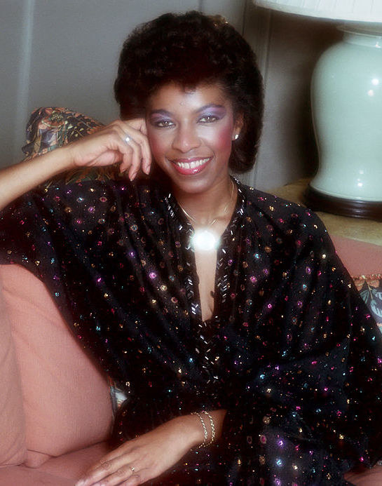 Cole posing for a portrait in 1983
