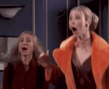 jennifer aniston and lisa kudrow jumping for joy in a scene from friends