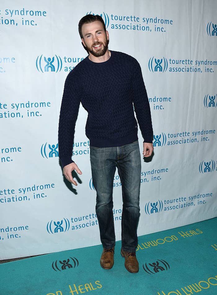 Chris Evans standing at an event
