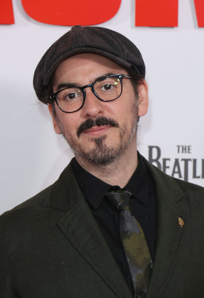 Dhani Harrison in glasses and a cap at &quot;The Beatles: Get Back&quot; premiere