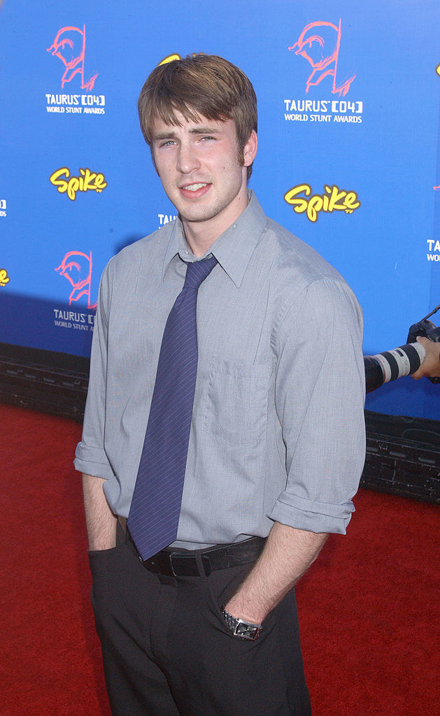a young Chris Evans with his hands in his pocket
