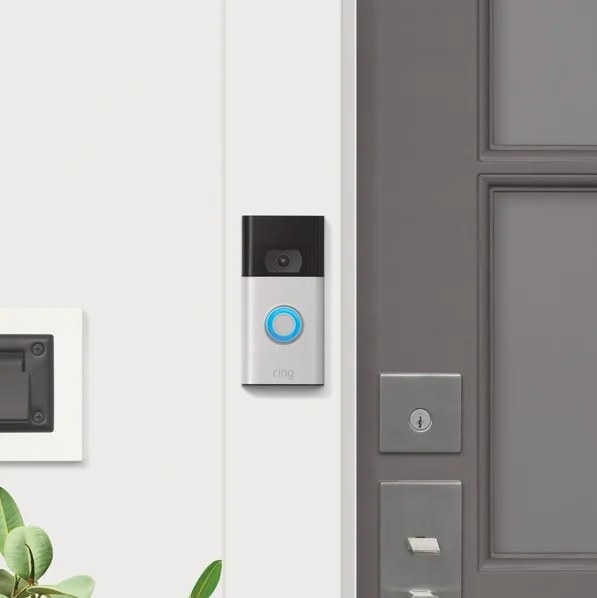Doorbell next to a gray door