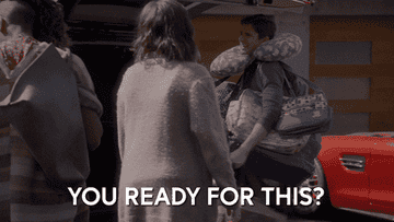 a gif of the actor Topher Grace in the show &quot;Home Economics&quot; wearing a bunch of diaper bags and saying &quot;You ready for this?&quot;