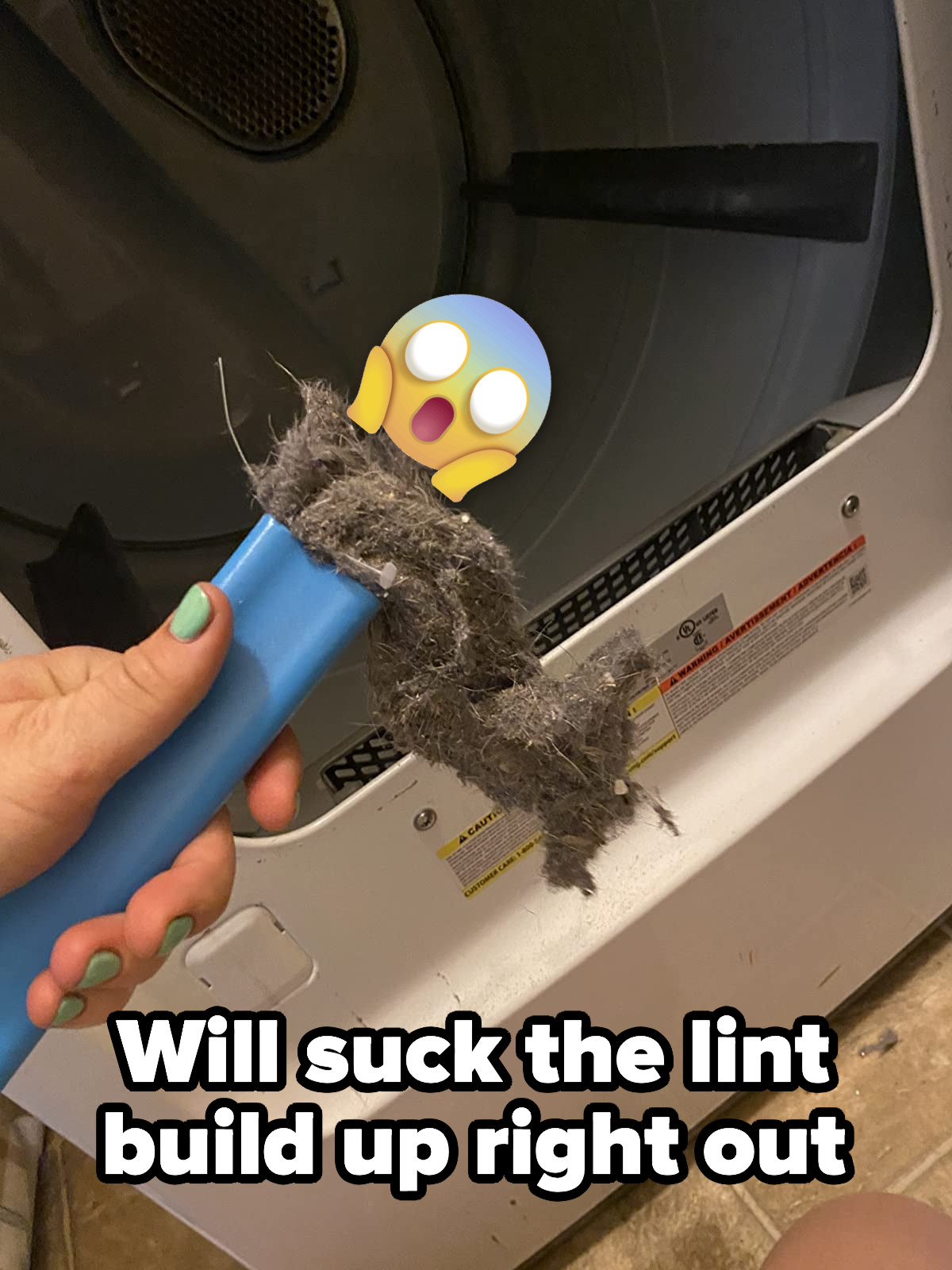 A customer review photo of the dryer vent cleaner filled with the dirt it collected