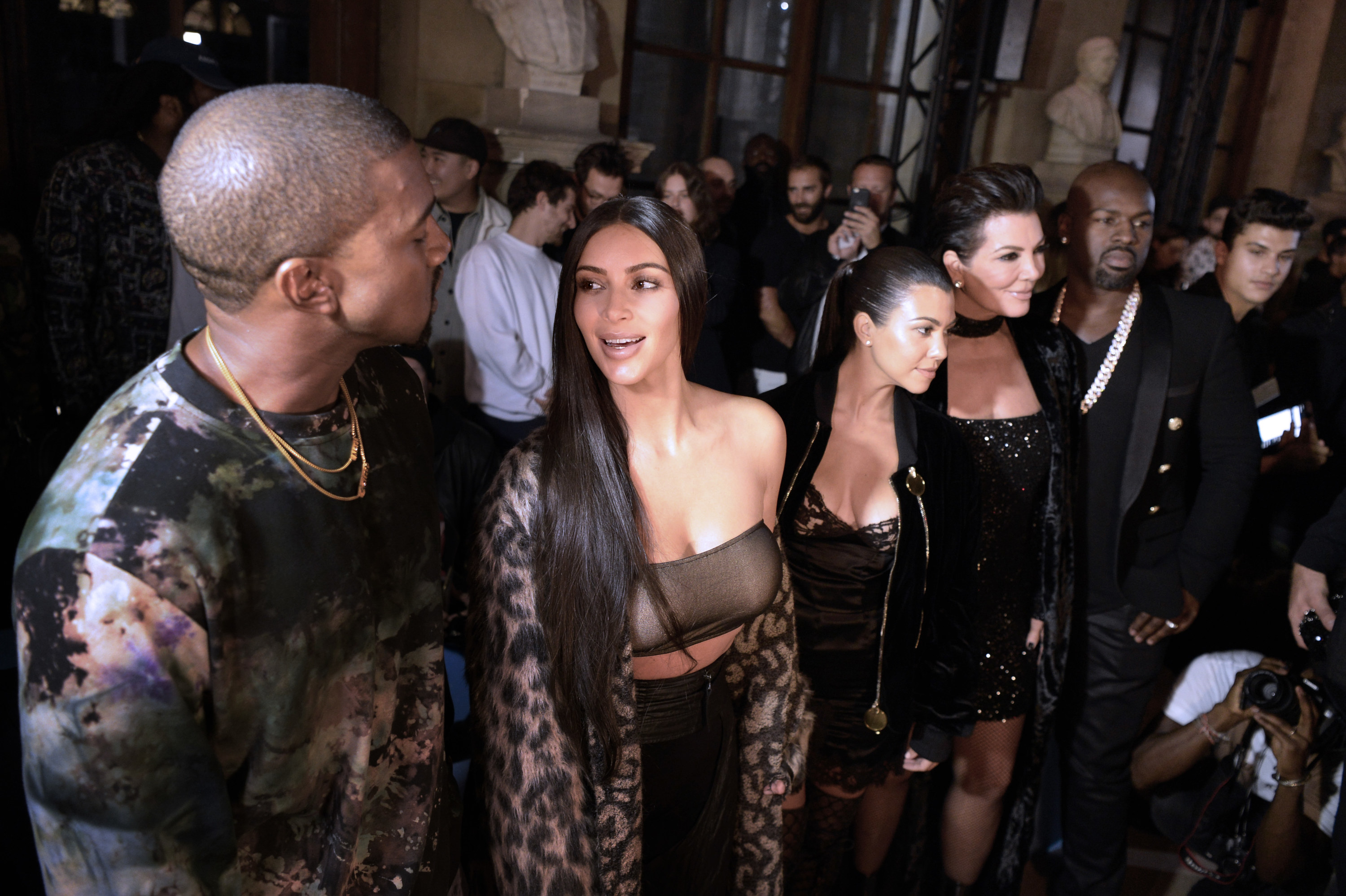 Kim and Kanye stand with Kourtney and Kris