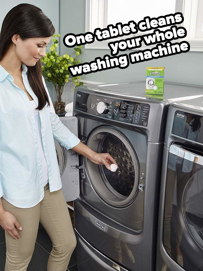 Product photo showing a model place Affresh washing machine tablets into their washing machine 