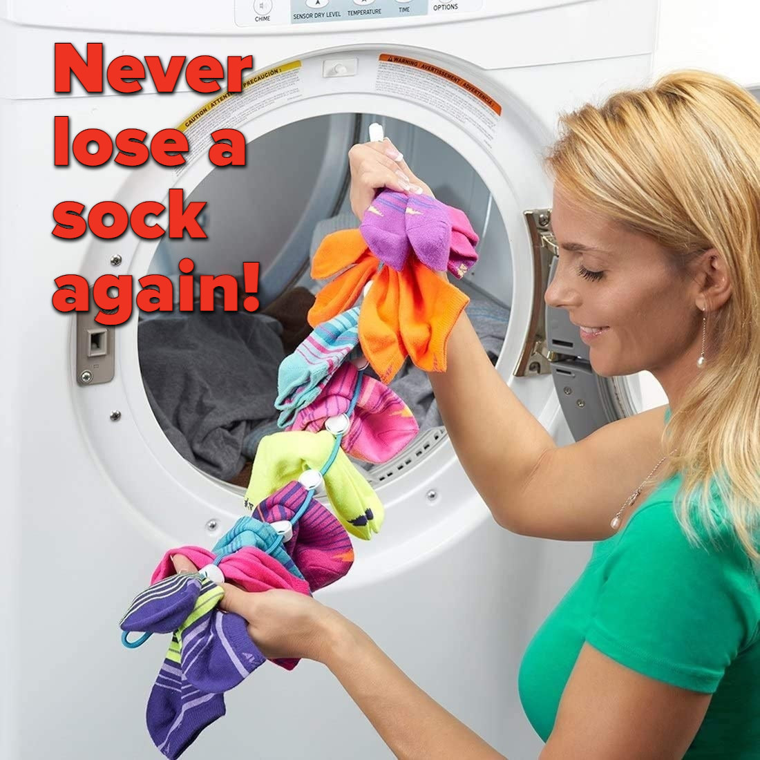A person pulling the SockDock out of a dryer with all the socks paired up and clean