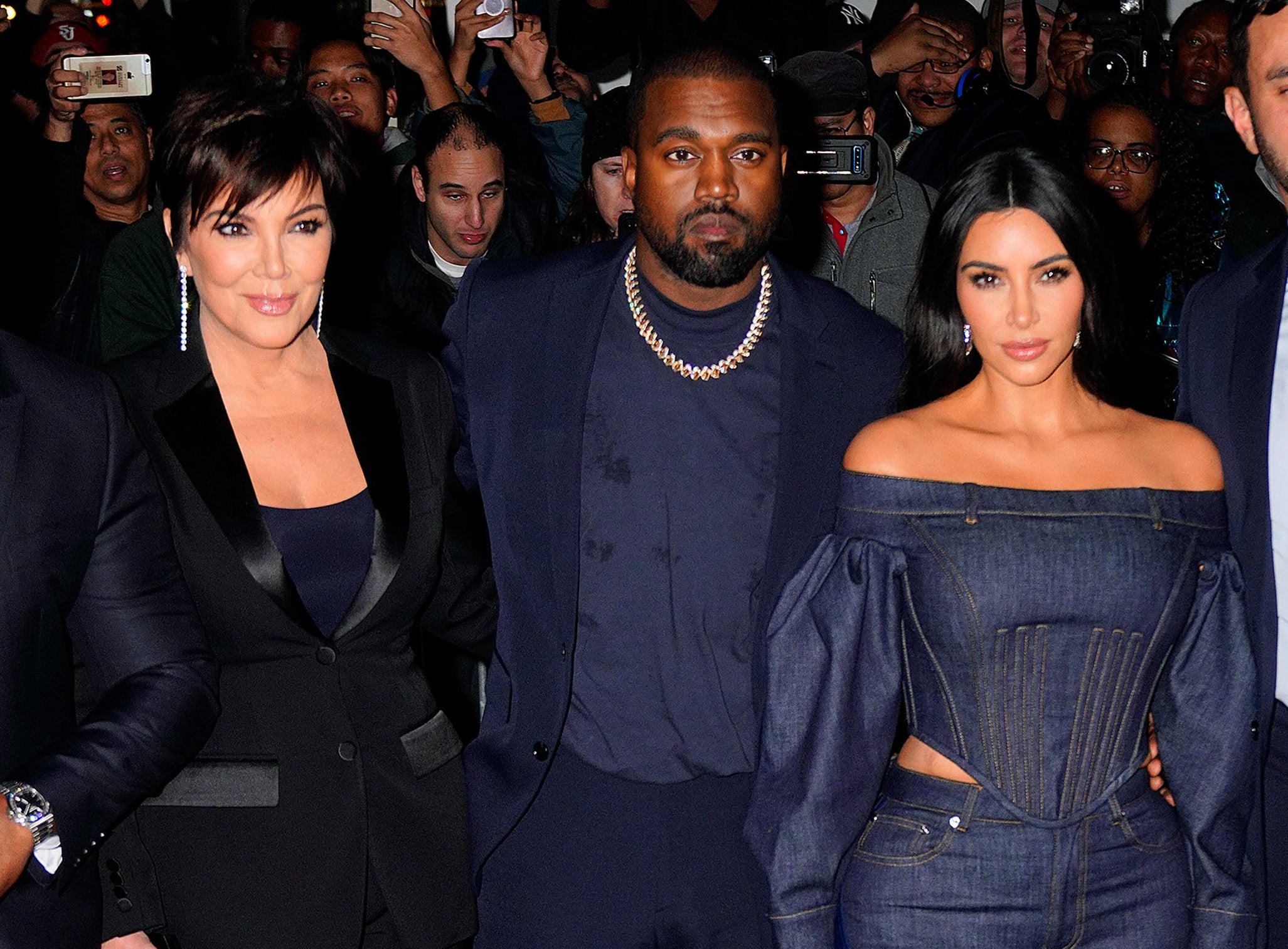 A closeup of Kim and Kanye and Kris