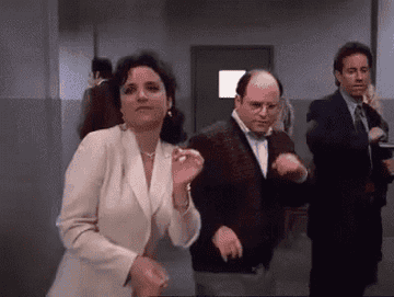 Seinfeld characters dancing in a hallway