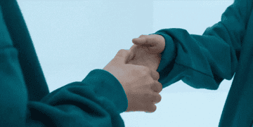 two players holding hands