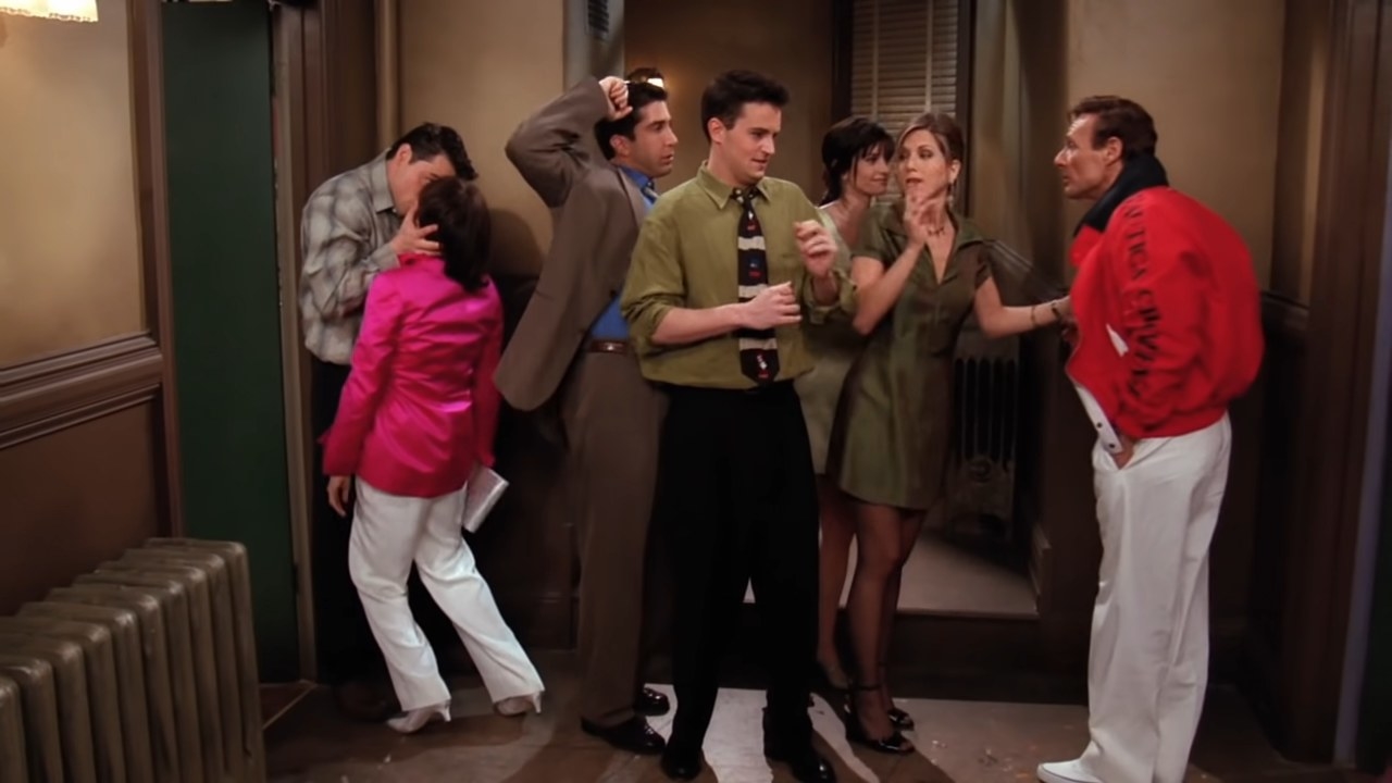 Joey kissing Mrs. Green with Ross, Chandler, Monica, and Rachel shield them from Mr. Green on &quot;Friends&quot;