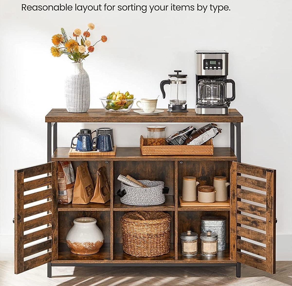 the cabinet in a room with the doors open showing what is stored inside