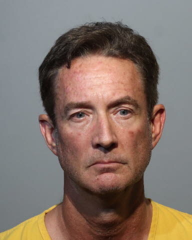 A white man in a mug shot