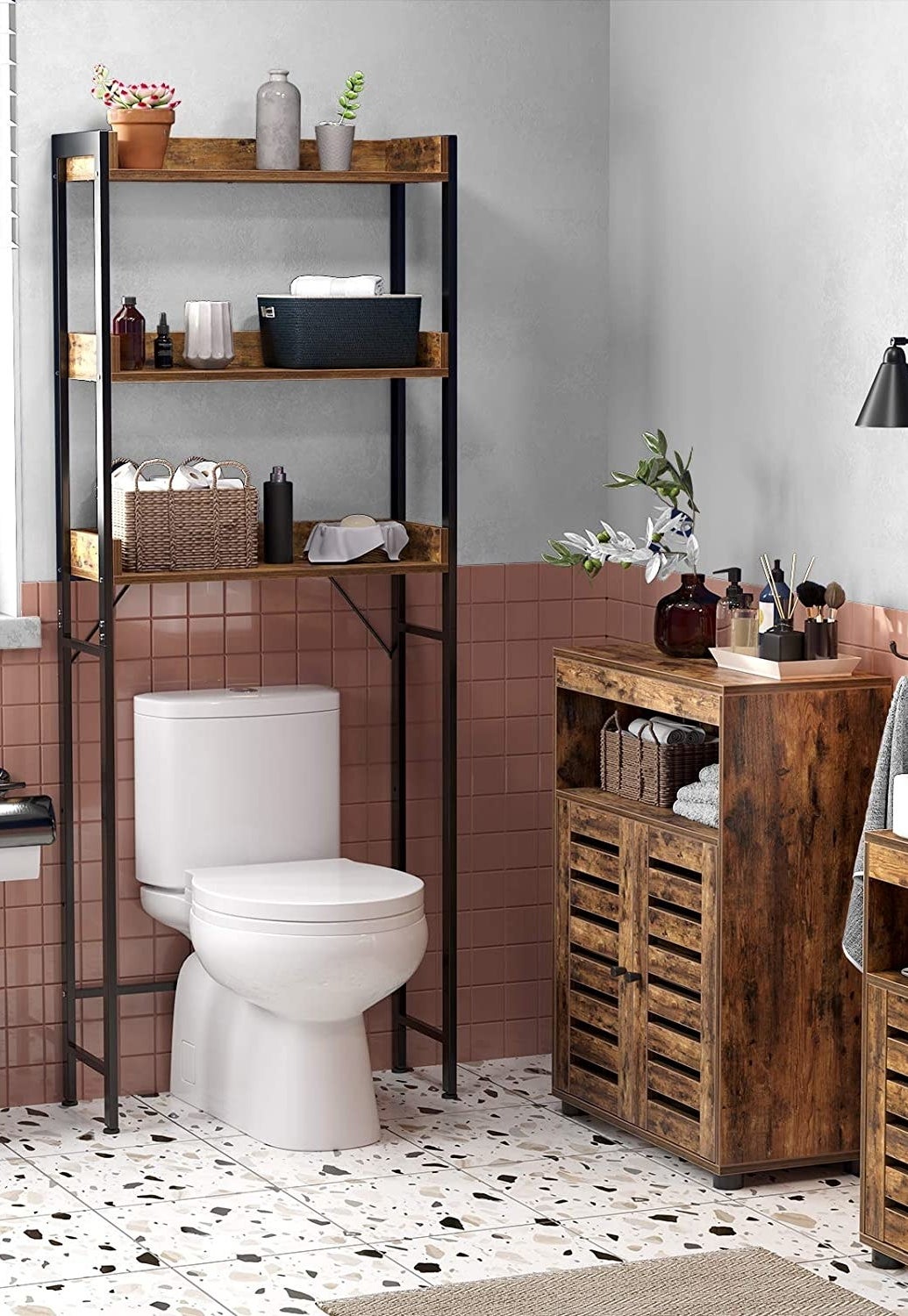 the storage shelf over a toilet in a trendy bathroom