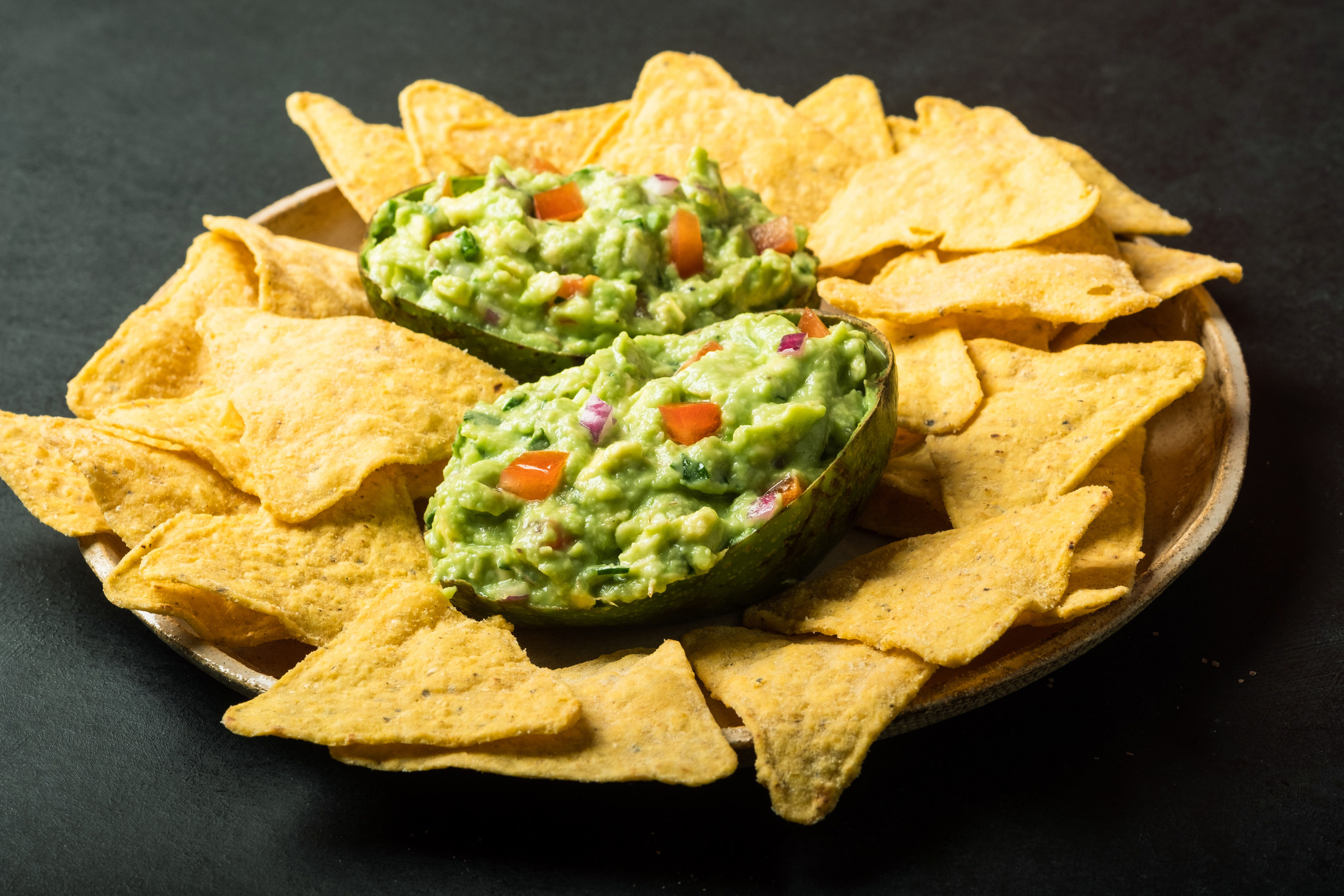 plate of guacamole and chips
