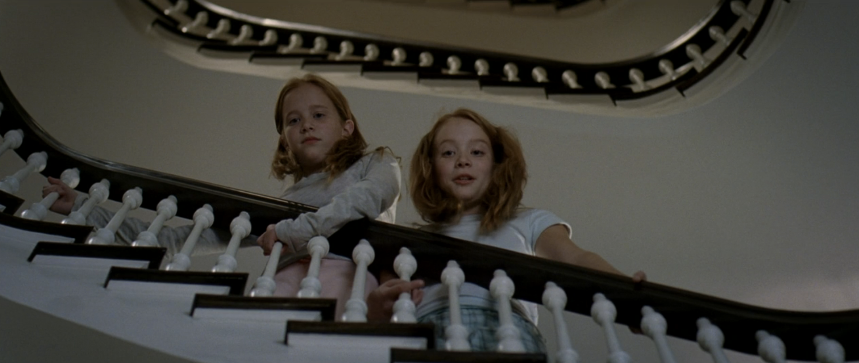 Miranda&#x27;s twin daughters standing on the stairs