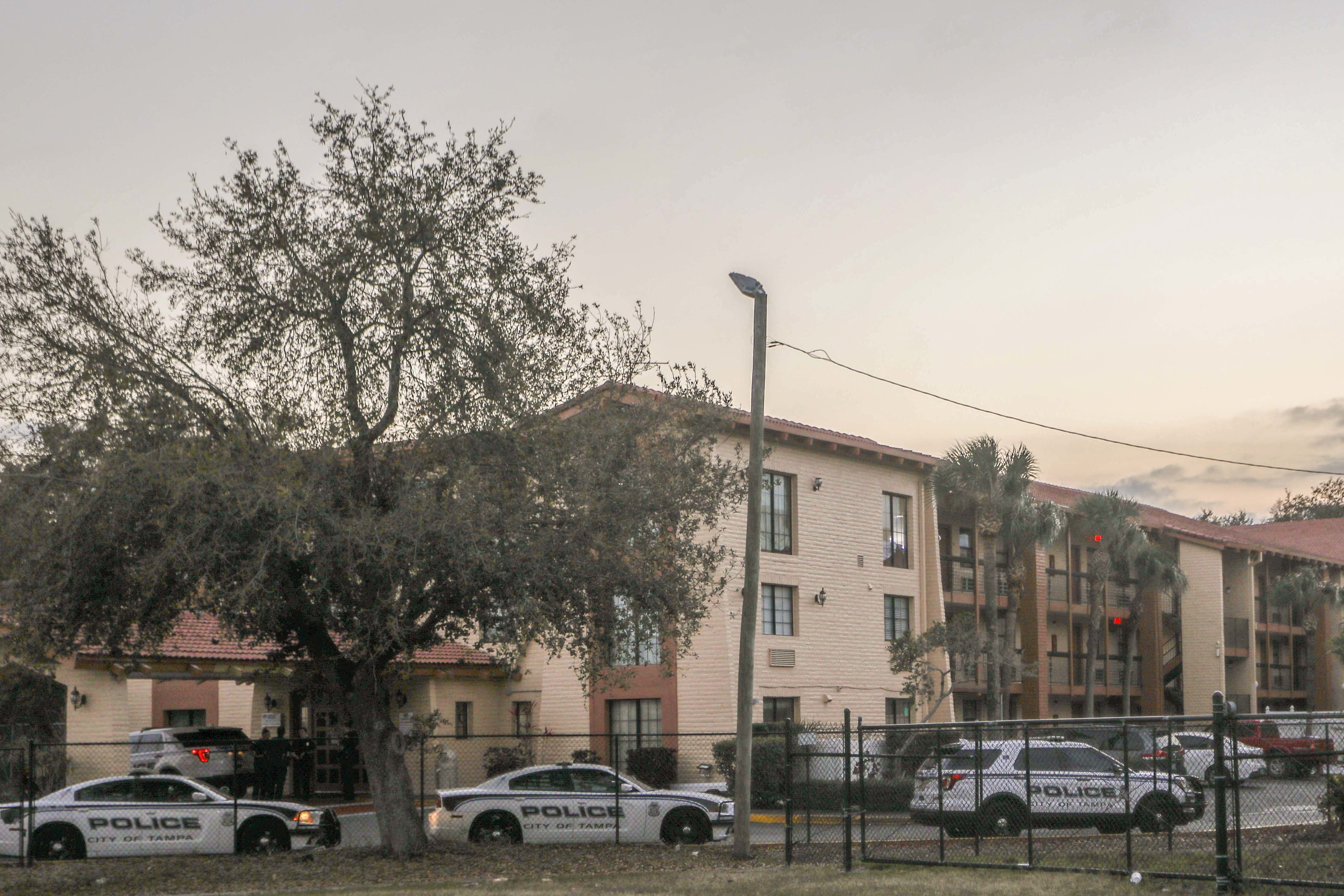 Tampa police cars parked outside an apartment complex