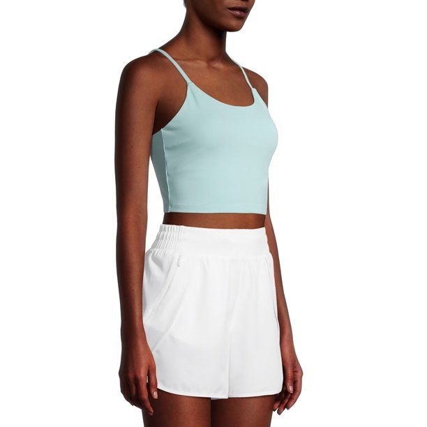 a model wearing the light blue sports crop top